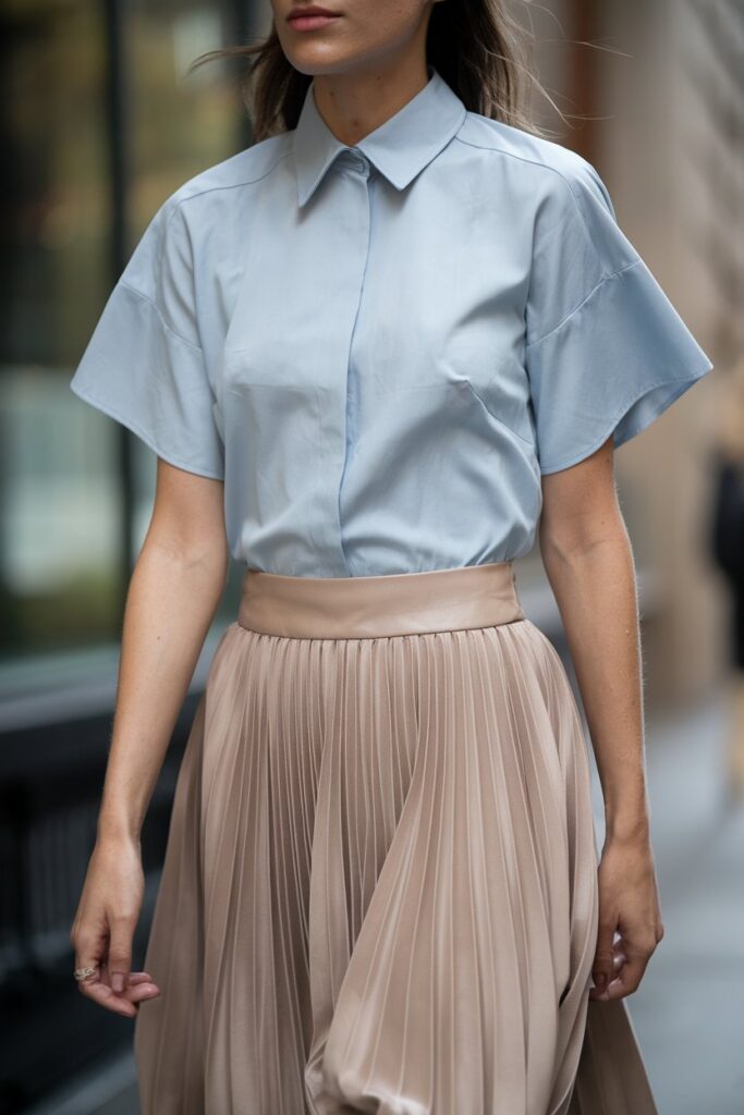 Effortlessly Stylish in a Light Blue Blouse and Pleated Skirt