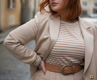 a stylish hourglass-shaped woman with red hair.